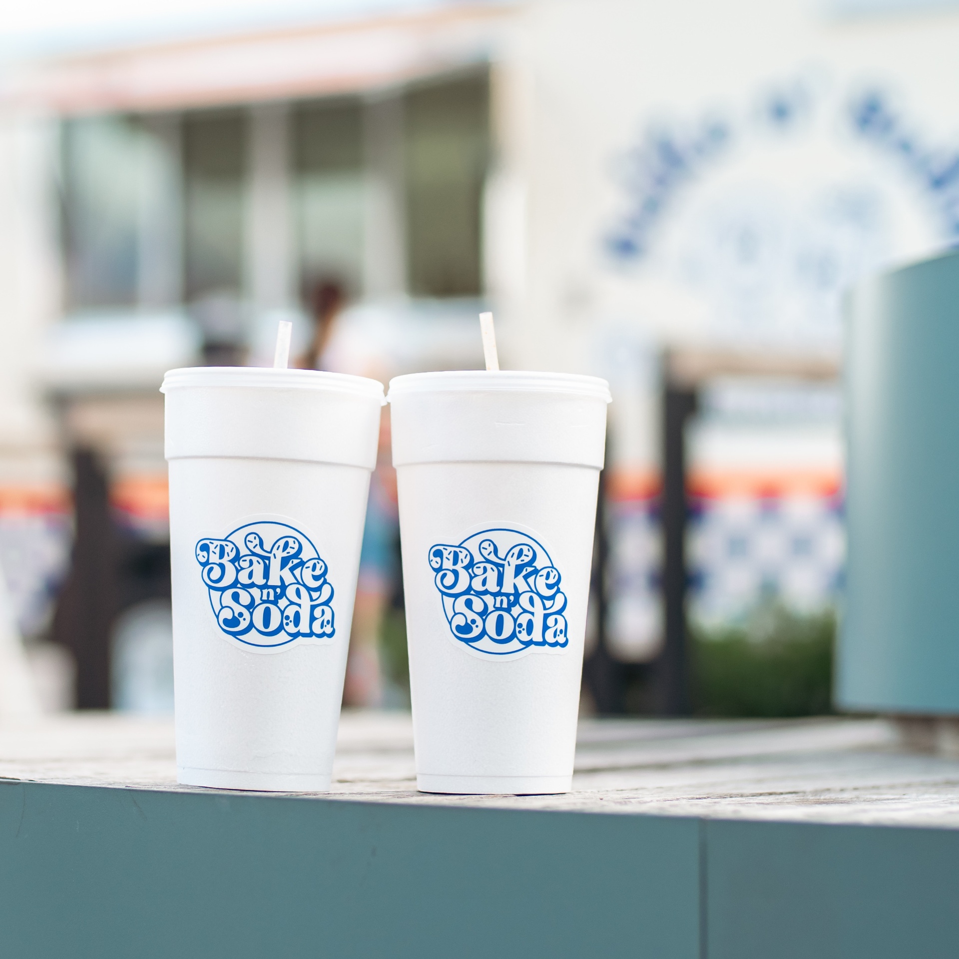 Two Bake n' Soda cups with branded stickers